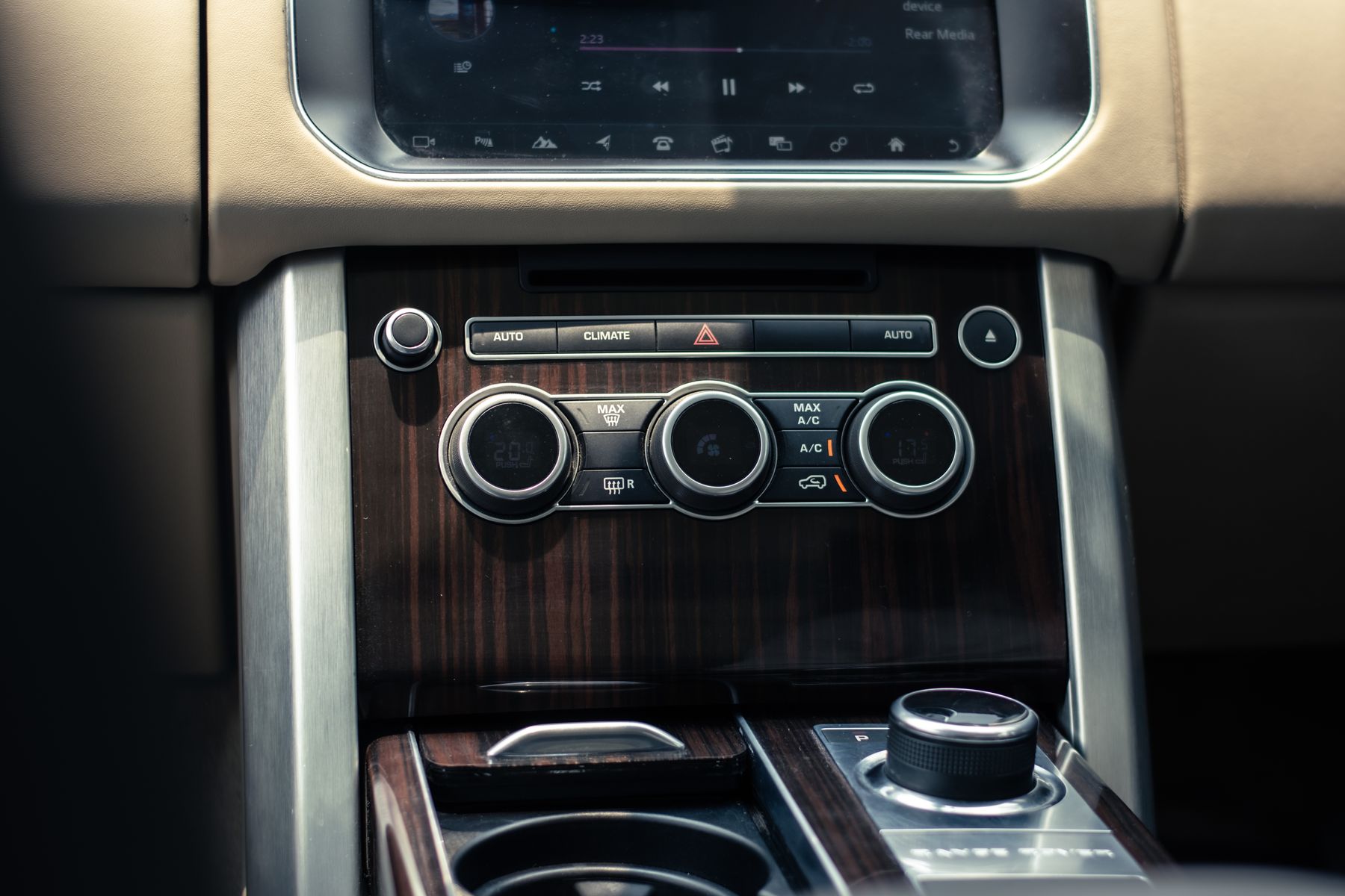 Close view of a vehicle dashboard and center console surfaces